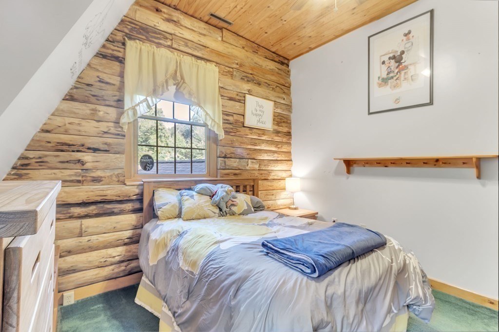 160 Laurel Hill Road Westhampton, MA 01027 - Photo 40 of 42 a bedroom with a bed and a window