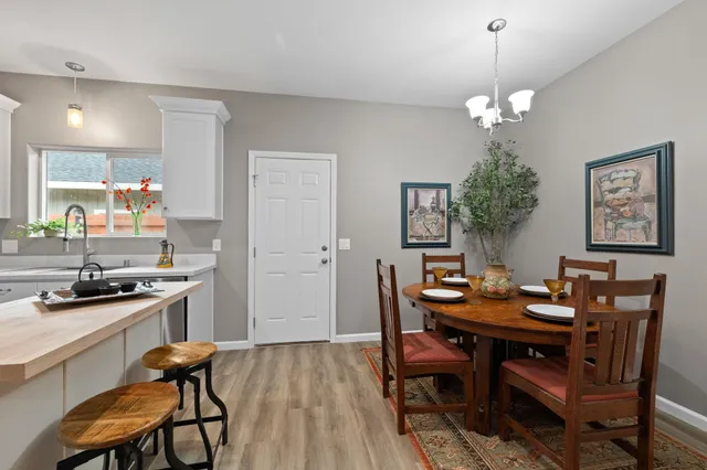 a kitchen with a sink a stove and cabinets