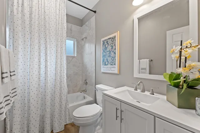 a bed room with a bed and a chair