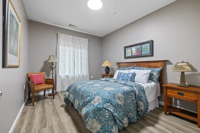 a bedroom with a bed and a couch