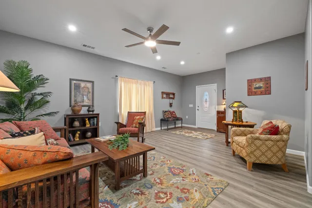 a view of a dining room with furniture and wooden floor