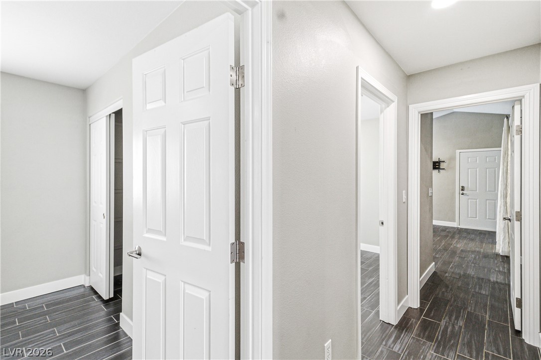 9523 Observer Street Las Vegas, NV 89123 - Photo 20 of 42 Clean lines and wood-look tile flooring define this crisp, modern hallway.