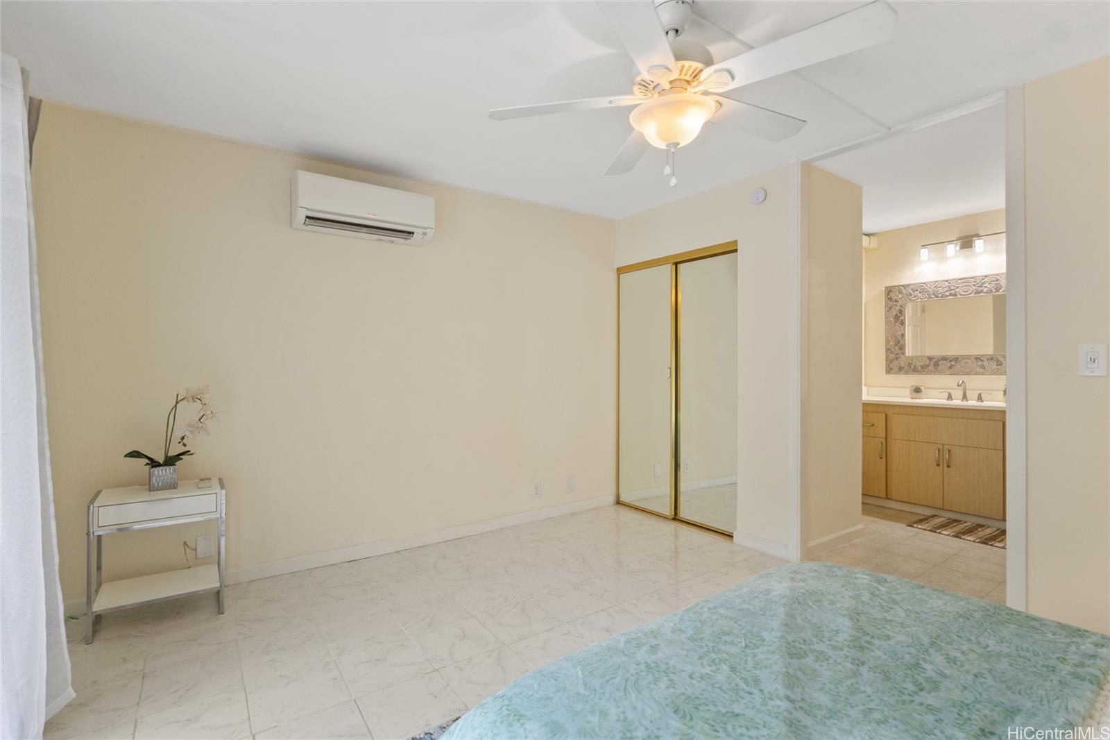 45-995 Wailele Road, Unit 29 Kaneohe, HI 96744 - Photo 14 of 25 a bathroom with a sink a light fixture and a mirror