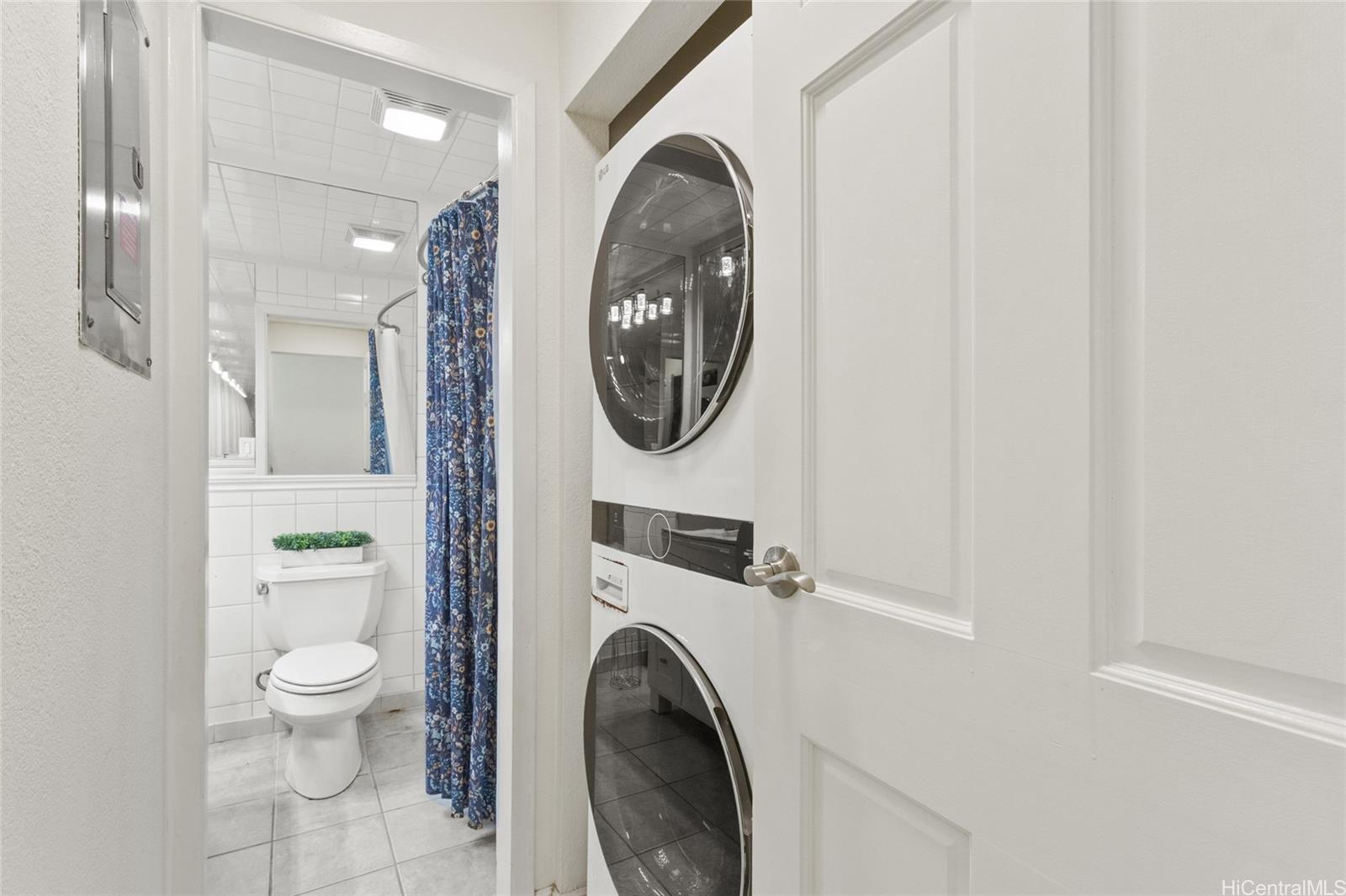 45-995 Wailele Road, Unit 29 Kaneohe, HI 96744 - Photo 17 of 25 a view of a hallway with washer and dryer