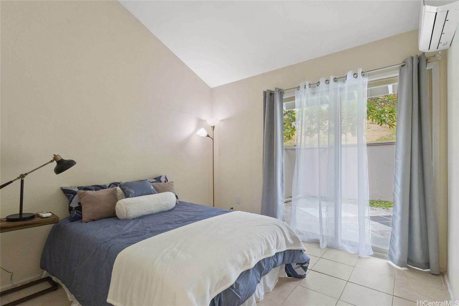 45-995 Wailele Road, Unit 29 Kaneohe, HI 96744 - Photo 20 of 25 a bedroom with a bed and a window