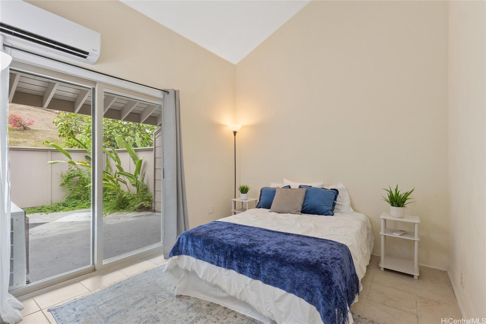 45-995 Wailele Road, Unit 29 Kaneohe, HI 96744 - Photo 21 of 25 a bedroom with a large bed and a window