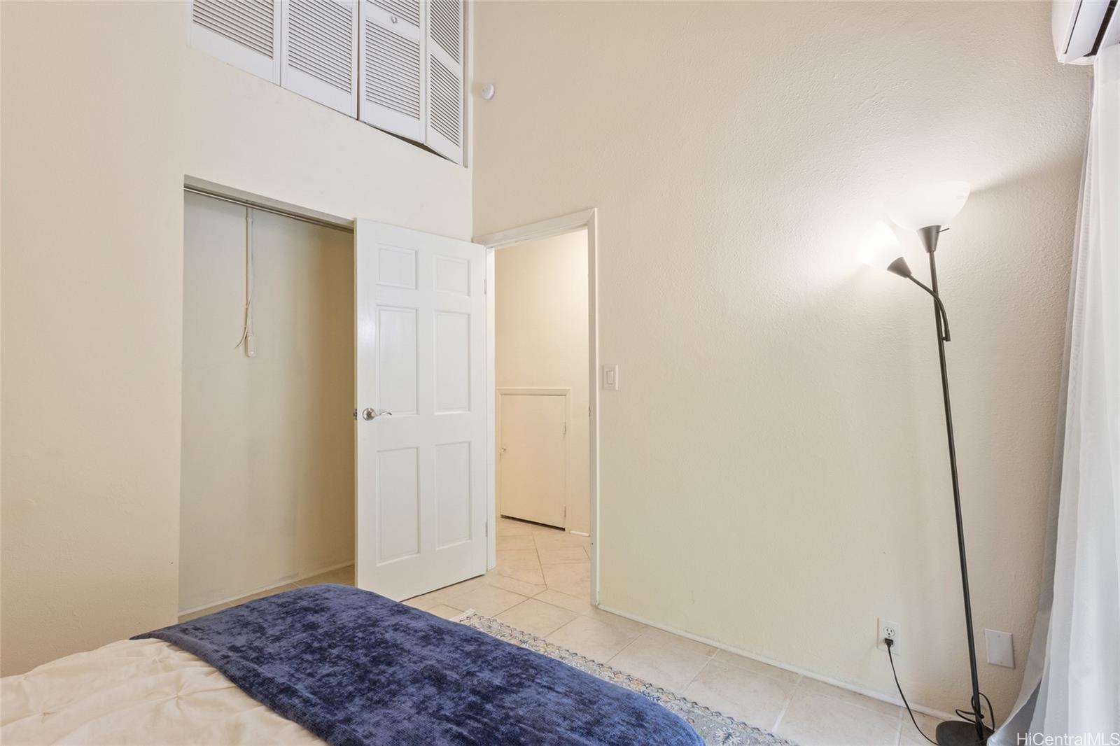 45-995 Wailele Road, Unit 29 Kaneohe, HI 96744 - Photo 22 of 25 a bedroom with a bed and a window