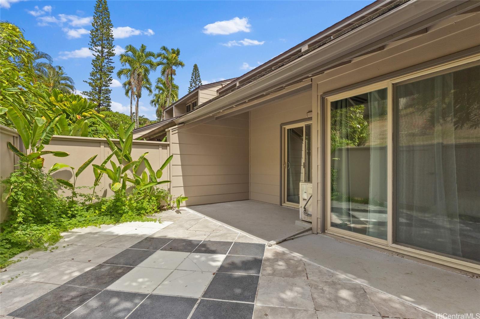 45-995 Wailele Road, Unit 29 Kaneohe, HI 96744 - Photo 24 of 25 a view of a house with a backyard