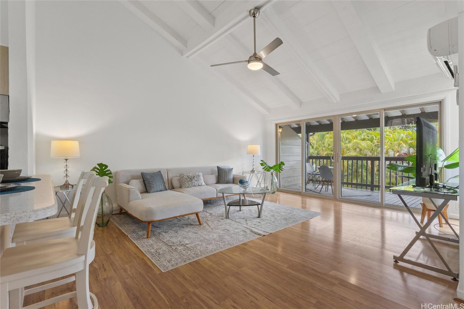 45-995 Wailele Road, Unit 29 Kaneohe, HI 96744 - Photo 9 of 25 a living room with furniture and a large window