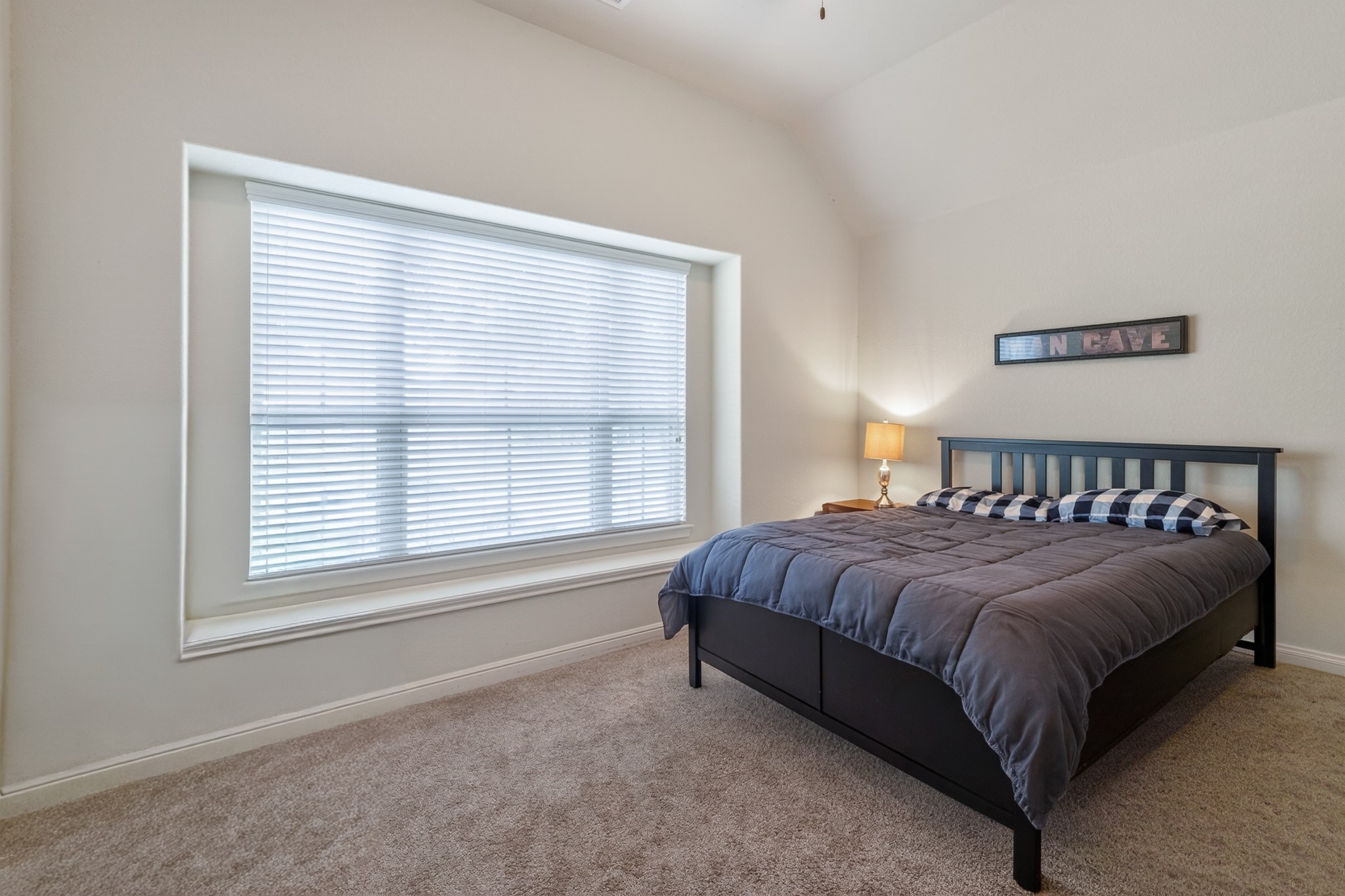 24711 East Burnaby Circle Spring, TX 77373 - Photo 17 of 20 a bed sitting in a bedroom next to a window
