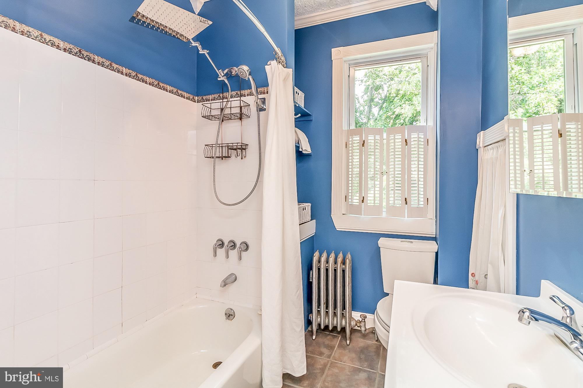 6211 Ridgeview Avenue Baltimore, MD 21206 - Photo 34 of 88 WHITE TILE SHOWER/TUB WITH RAIN SHOWER HEAD