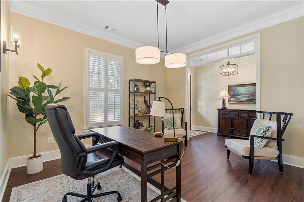 2995 Gum Creek Road Oxford, GA 30054 - Photo 20 of 51 a view of a workspace with furniture and a chandelier