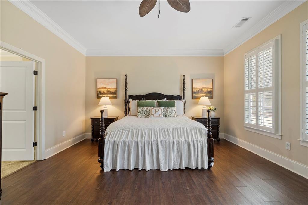 2995 Gum Creek Road Oxford, GA 30054 - Photo 21 of 51 a bedroom with a bed and wooden floor