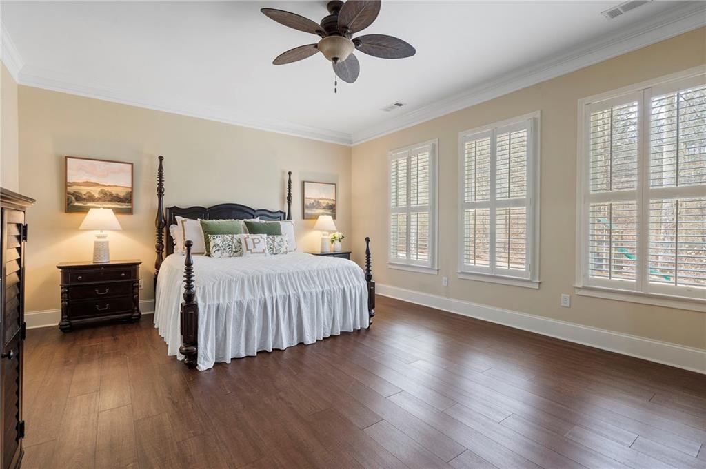 2995 Gum Creek Road Oxford, GA 30054 - Photo 22 of 51 a bedroom with a bed and wooden floor