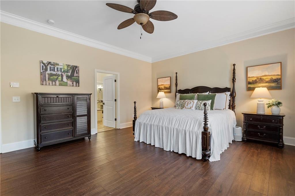 2995 Gum Creek Road Oxford, GA 30054 - Photo 23 of 51 a bedroom with a bed and wooden floor