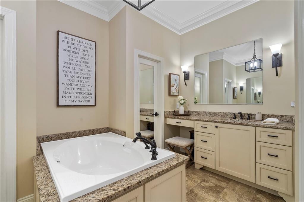 2995 Gum Creek Road Oxford, GA 30054 - Photo 26 of 51 a bath room with a sink and a mirror