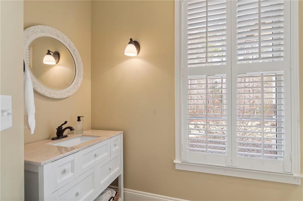 2995 Gum Creek Road Oxford, GA 30054 - Photo 27 of 59 a bathroom with a sink and a mirror