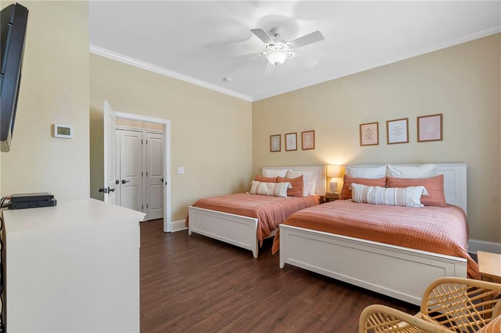 2995 Gum Creek Road Oxford, GA 30054 - Photo 27 of 51 a bedroom with a bed and a chandelier
