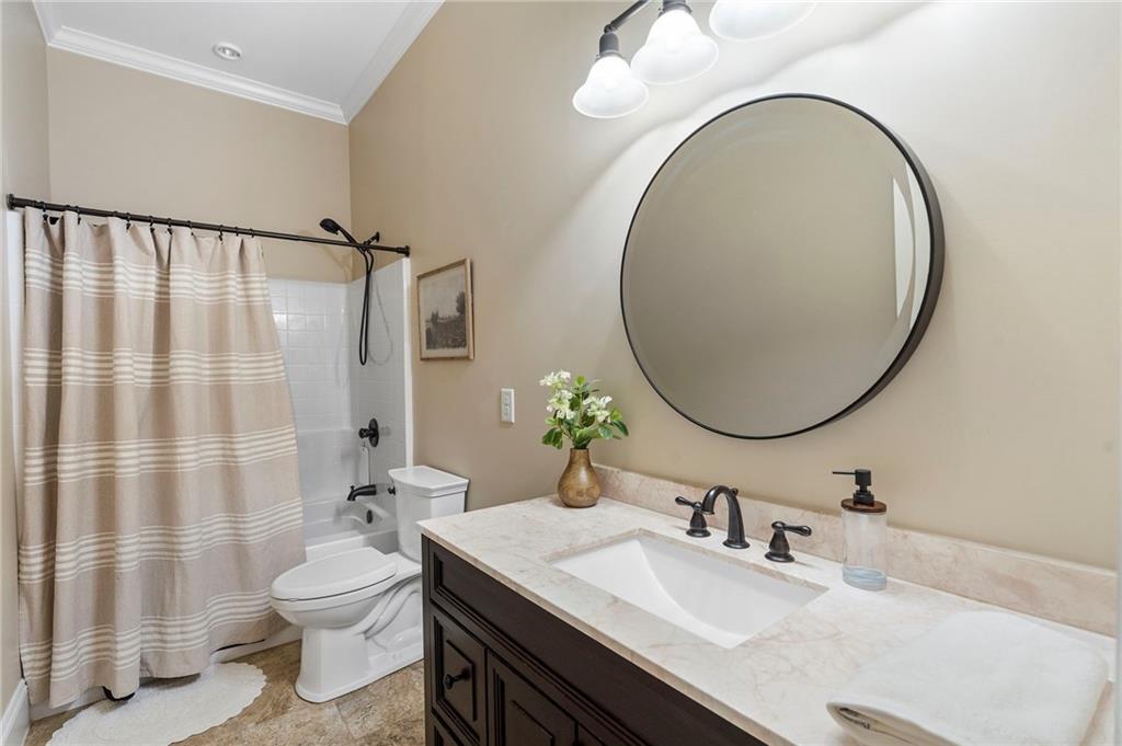 2995 Gum Creek Road Oxford, GA 30054 - Photo 32 of 59 a bathroom with a sink a toilet and a mirror