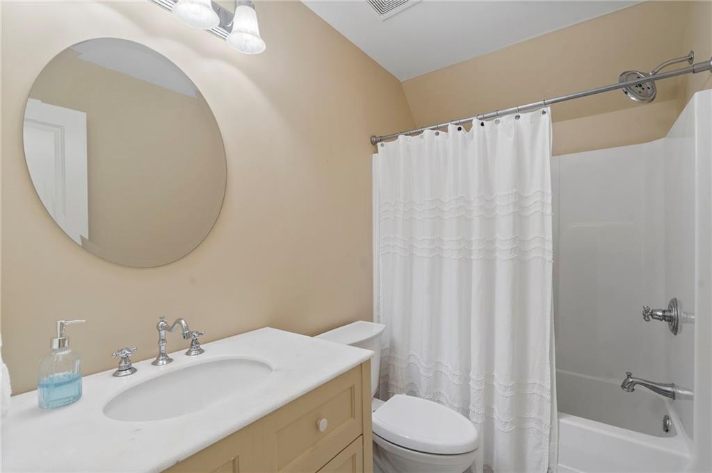 2995 Gum Creek Road Oxford, GA 30054 - Photo 37 of 51 a bathroom with a sink vanity mirror and toilet