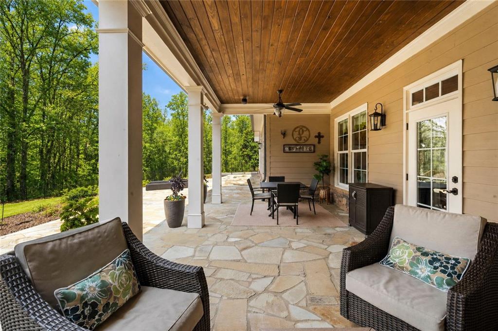 2995 Gum Creek Road Oxford, GA 30054 - Photo 38 of 51 a outdoor space with patio the couches and a dining table with garden view