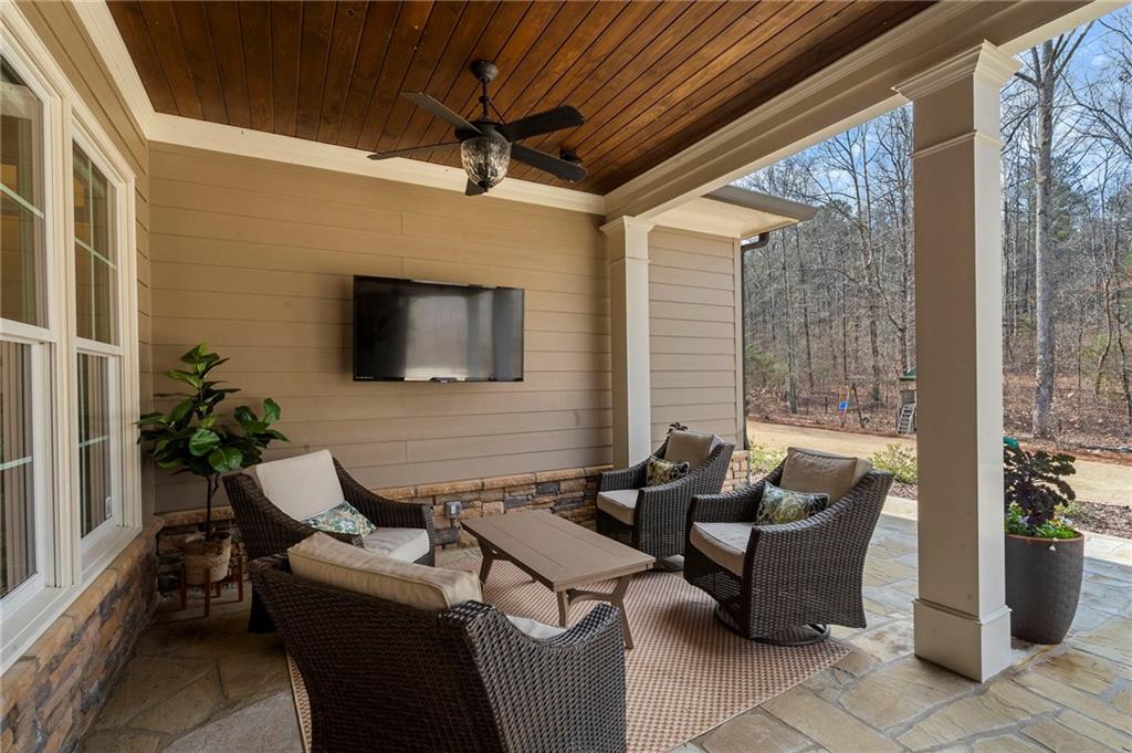 2995 Gum Creek Road Oxford, GA 30054 - Photo 39 of 59 a living room with furniture and a flat screen tv