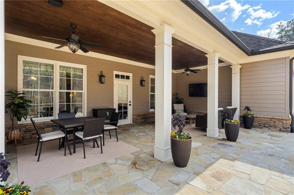2995 Gum Creek Road Oxford, GA 30054 - Photo 41 of 59 a view of a patio with chairs and potted plants