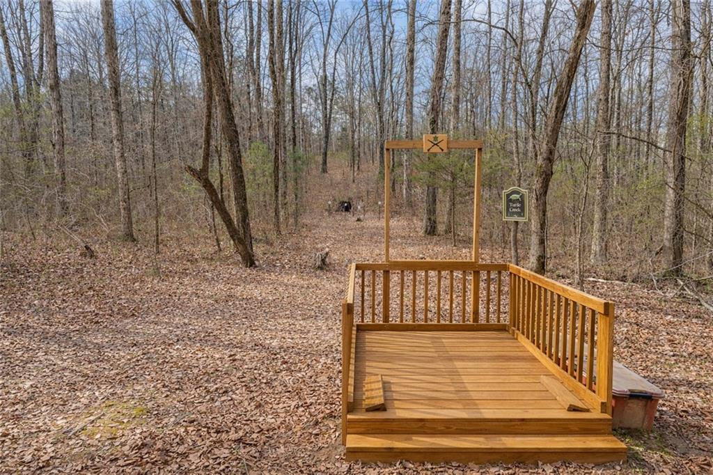 2995 Gum Creek Road Oxford, GA 30054 - Photo 47 of 59 a view of balcony with wooden floor and outdoor space