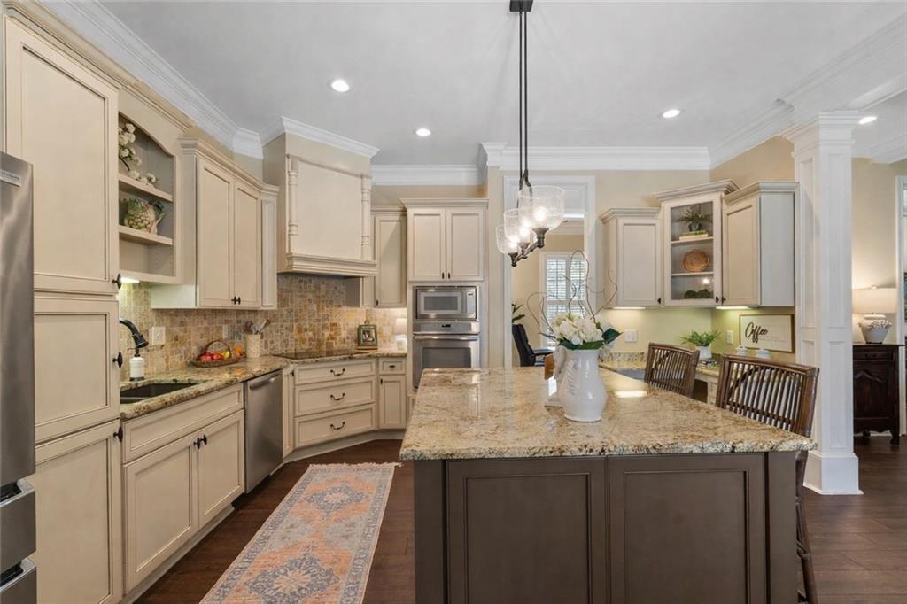 2995 Gum Creek Road Oxford, GA 30054 - Photo 6 of 51 a kitchen with stainless steel appliances granite countertop a sink stove and refrigerator
