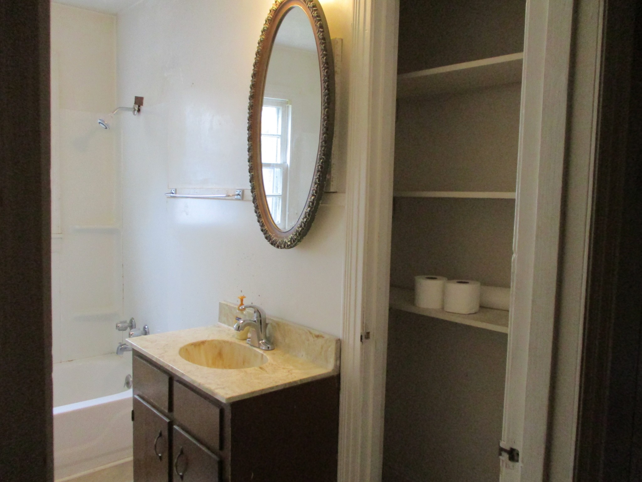 1003 Hickory Ridge Road Lebanon, TN 37087 - Photo 16 of 18 a bathroom with a sink and a mirror