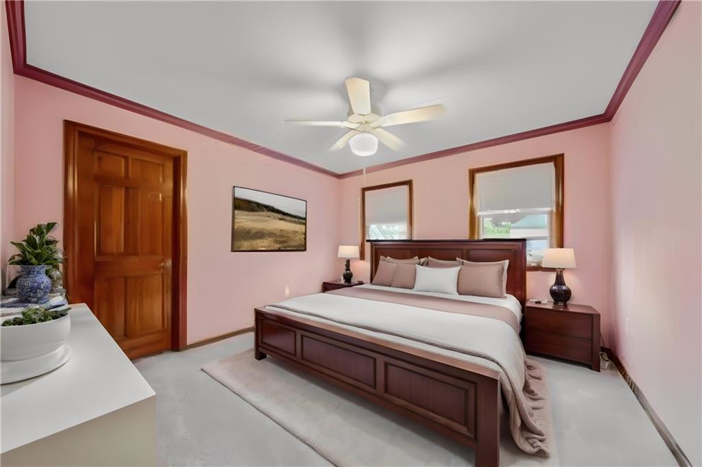 220 Tiffany Irwin, PA 15642 - Photo 22 of 39 a bedroom with a bed and a chandelier