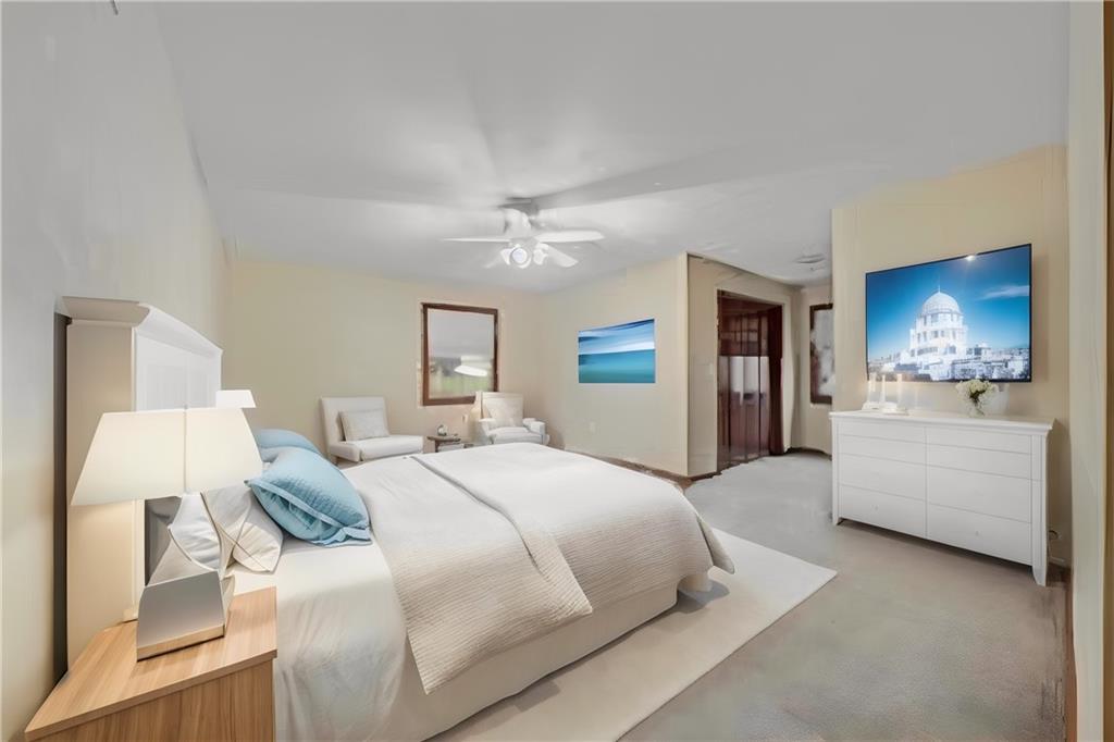 220 Tiffany Irwin, PA 15642 - Photo 23 of 39 a spacious bedroom with a bed and a chandelier