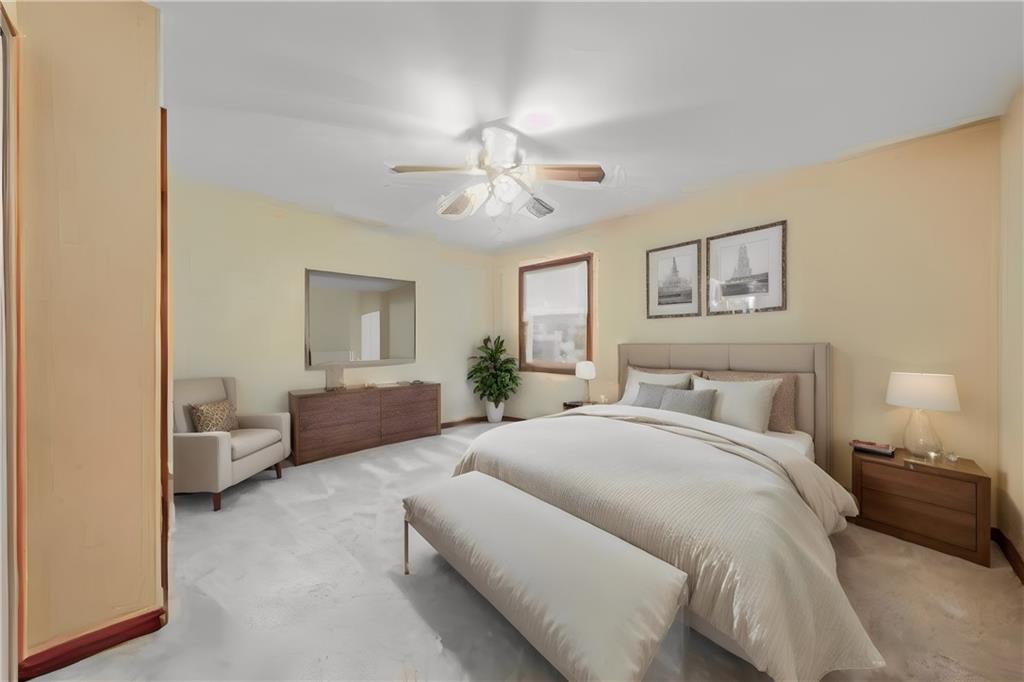 220 Tiffany Irwin, PA 15642 - Photo 24 of 39 a spacious bedroom with a bed and ceiling fan