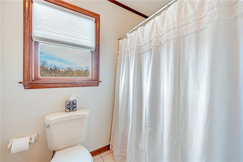 220 Tiffany Irwin, PA 15642 - Photo 27 of 39 a white toilet sitting next to a bathroom sink