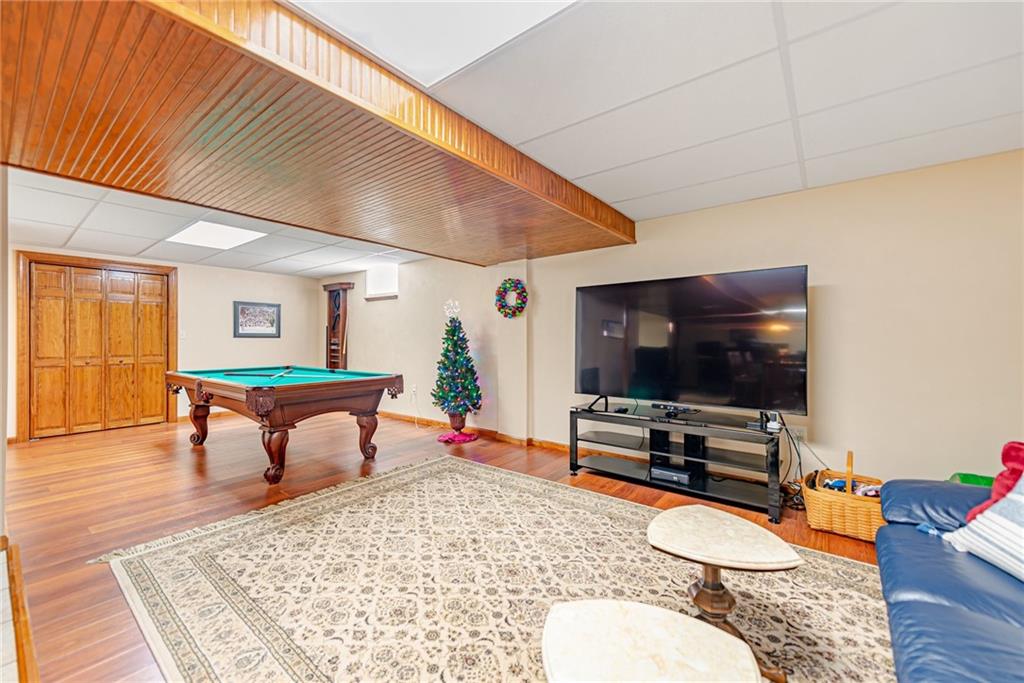 220 Tiffany Irwin, PA 15642 - Photo 29 of 39 a living room with furniture and a flat screen tv