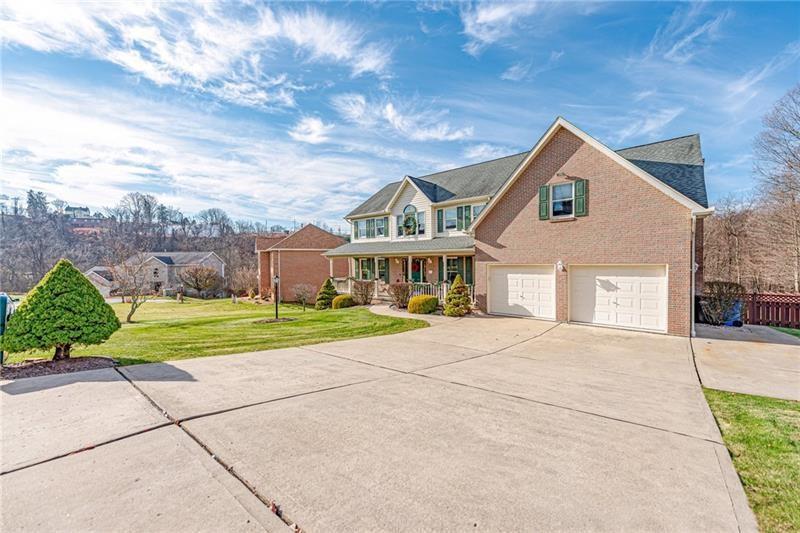 220 Tiffany Irwin, PA 15642 - Photo 3 of 39 a front view of house with yard and green space