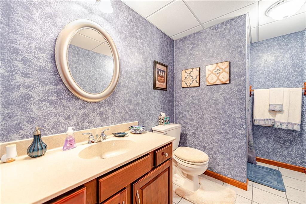 220 Tiffany Irwin, PA 15642 - Photo 31 of 39 a bathroom with a sink a toilet and a mirror