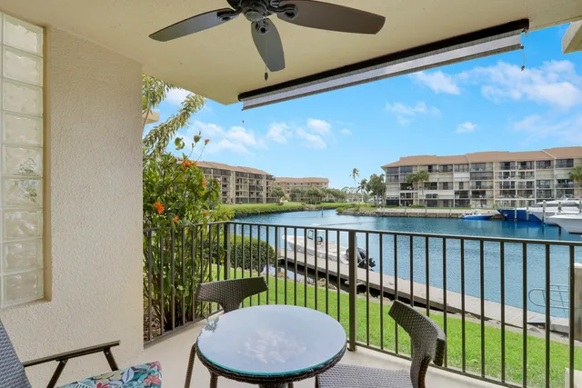 a view of a balcony with furniture