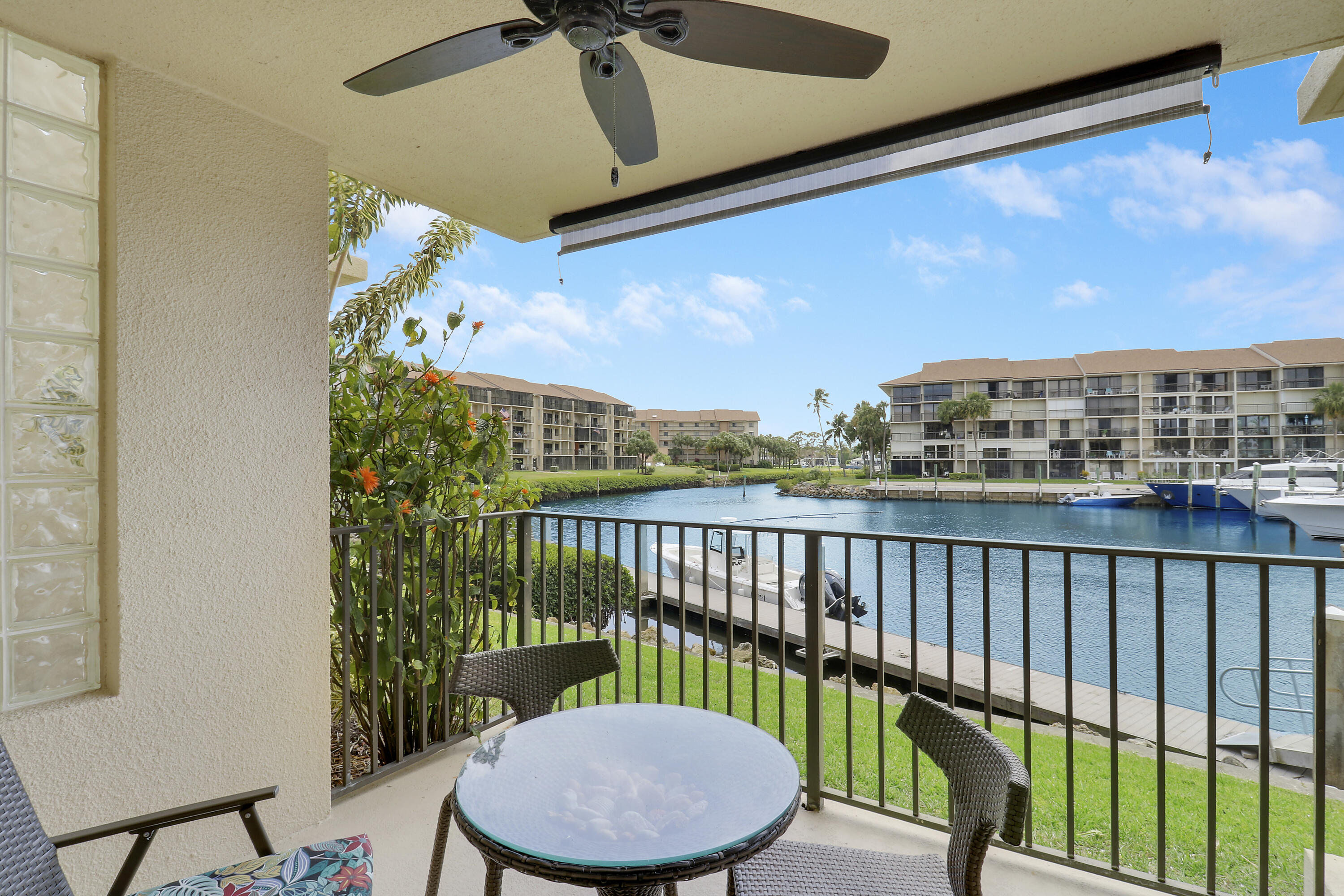 1301 Seafarer Circle, Unit 105 Jupiter, FL 33477 - Photo 11 of 37 Back Patio Behind Primary