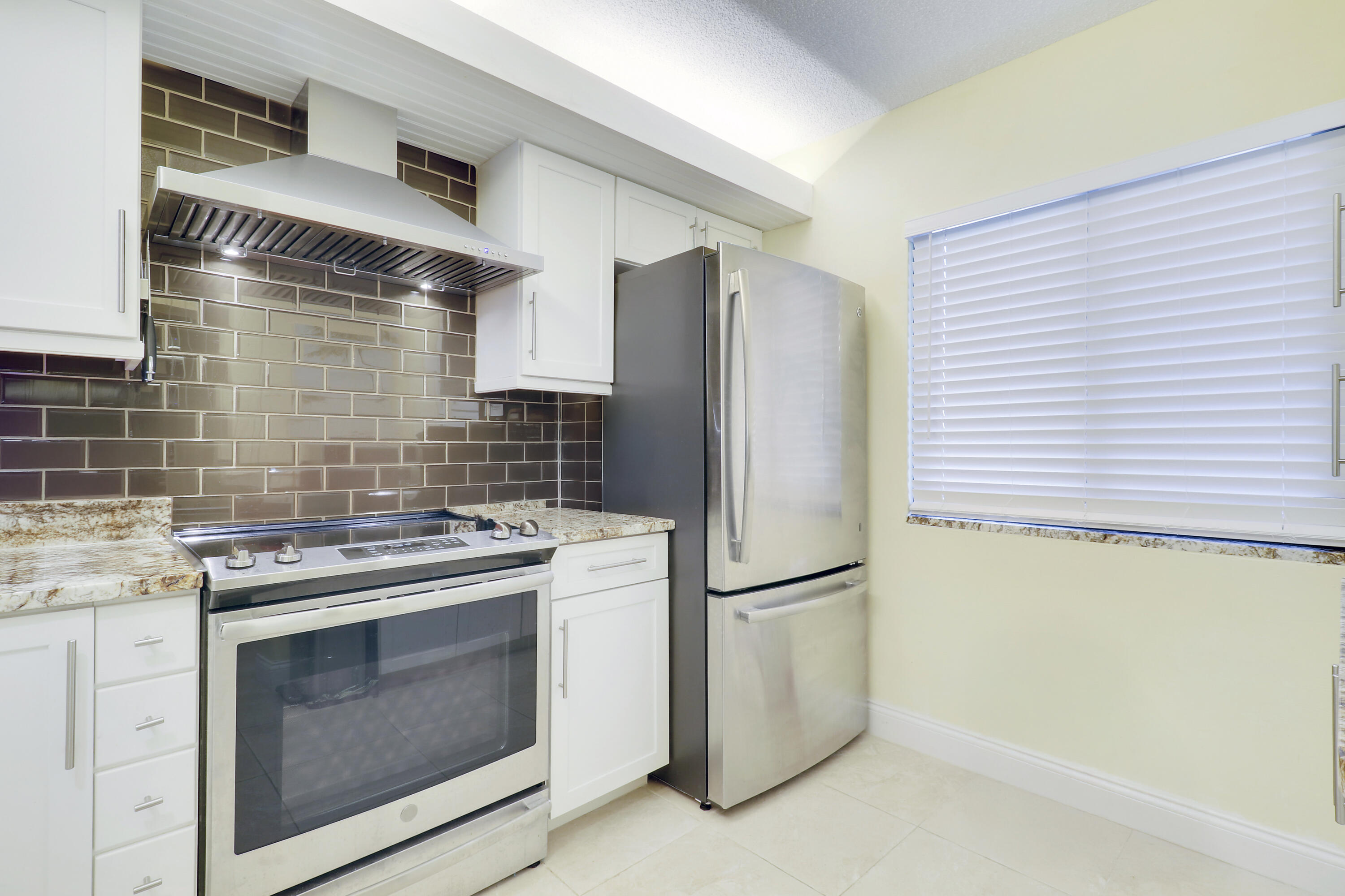 1301 Seafarer Circle, Unit 105 Jupiter, FL 33477 - Photo 21 of 37 Updated Kitchen