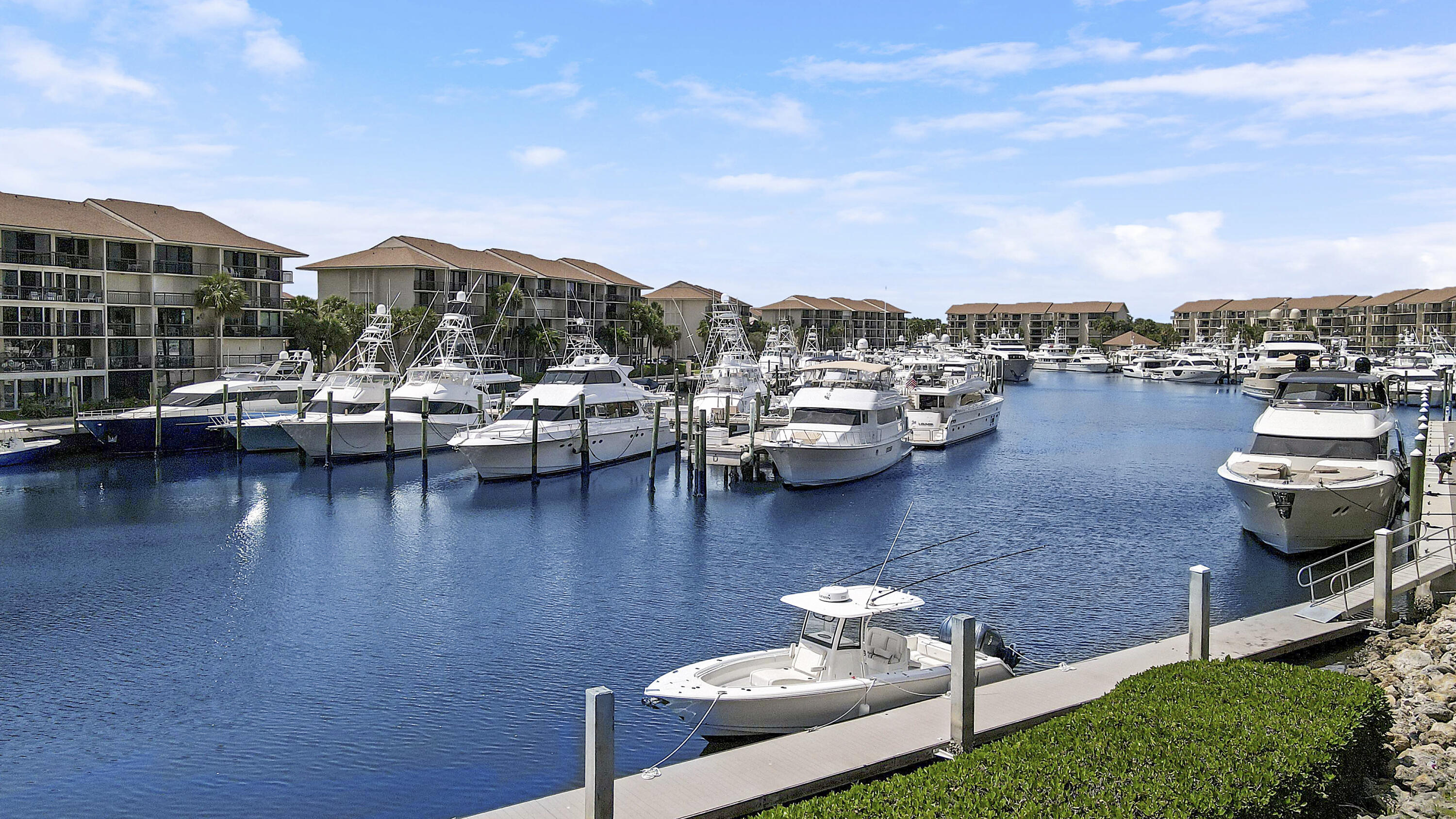 1301 Seafarer Circle, Unit 105 Jupiter, FL 33477 - Photo 32 of 37 Dock Behind Extended Patio