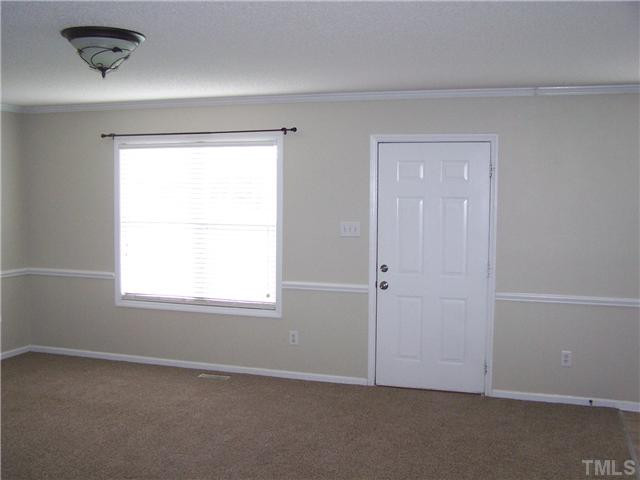 1257 Sanders Road Benson, NC 27504 - Photo 6 of 15 View from foyer into family room with new carpet Den/Family/Great Room