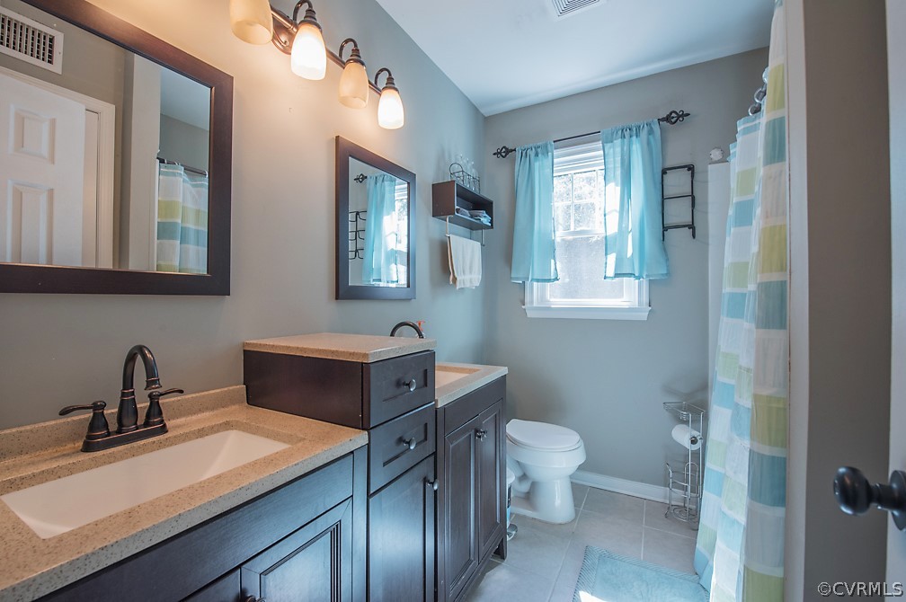 12109 Bundle Road Chesterfield, VA 23838 - Photo 14 of 31 Downstairs hall bath with dual vanity.