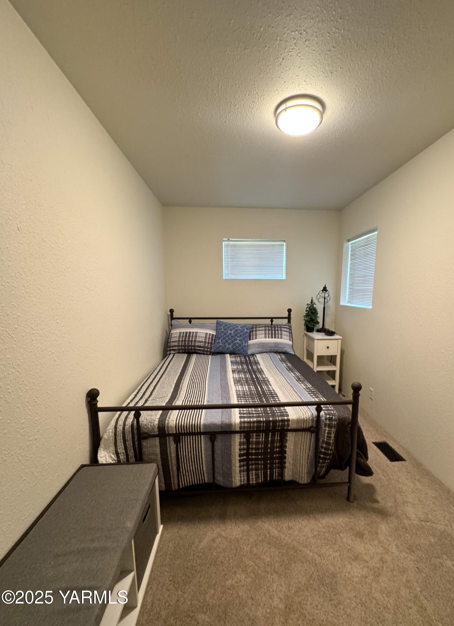 2060 Cemetery Road Sunnyside, WA 98944 - Photo 19 of 29 a bed room with a bed and a night stand