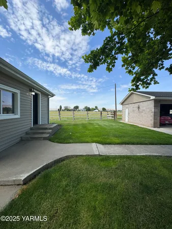 a view of a house with a big yard