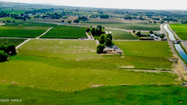a view of a lake with a yard