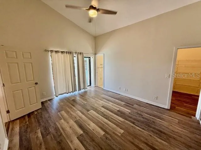 wooden floor in an empty room with a window