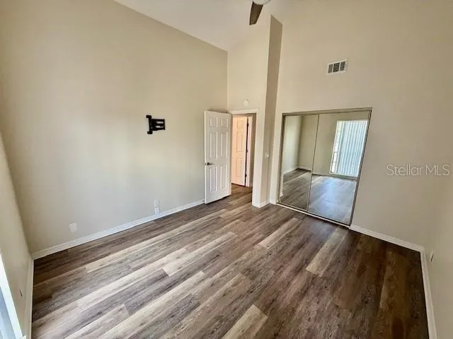 a view of a room with wooden floor and staircase