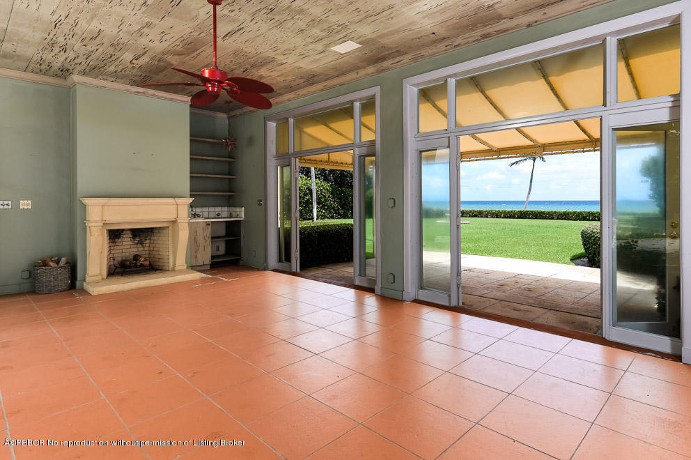 89 Middle Road Palm Beach, FL 33480 - Photo 11 of 23 a view of an empty room with a window and kitchen view