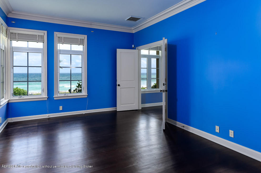 89 Middle Road Palm Beach, FL 33480 - Photo 17 of 23 a view of an empty room with window and wooden floor